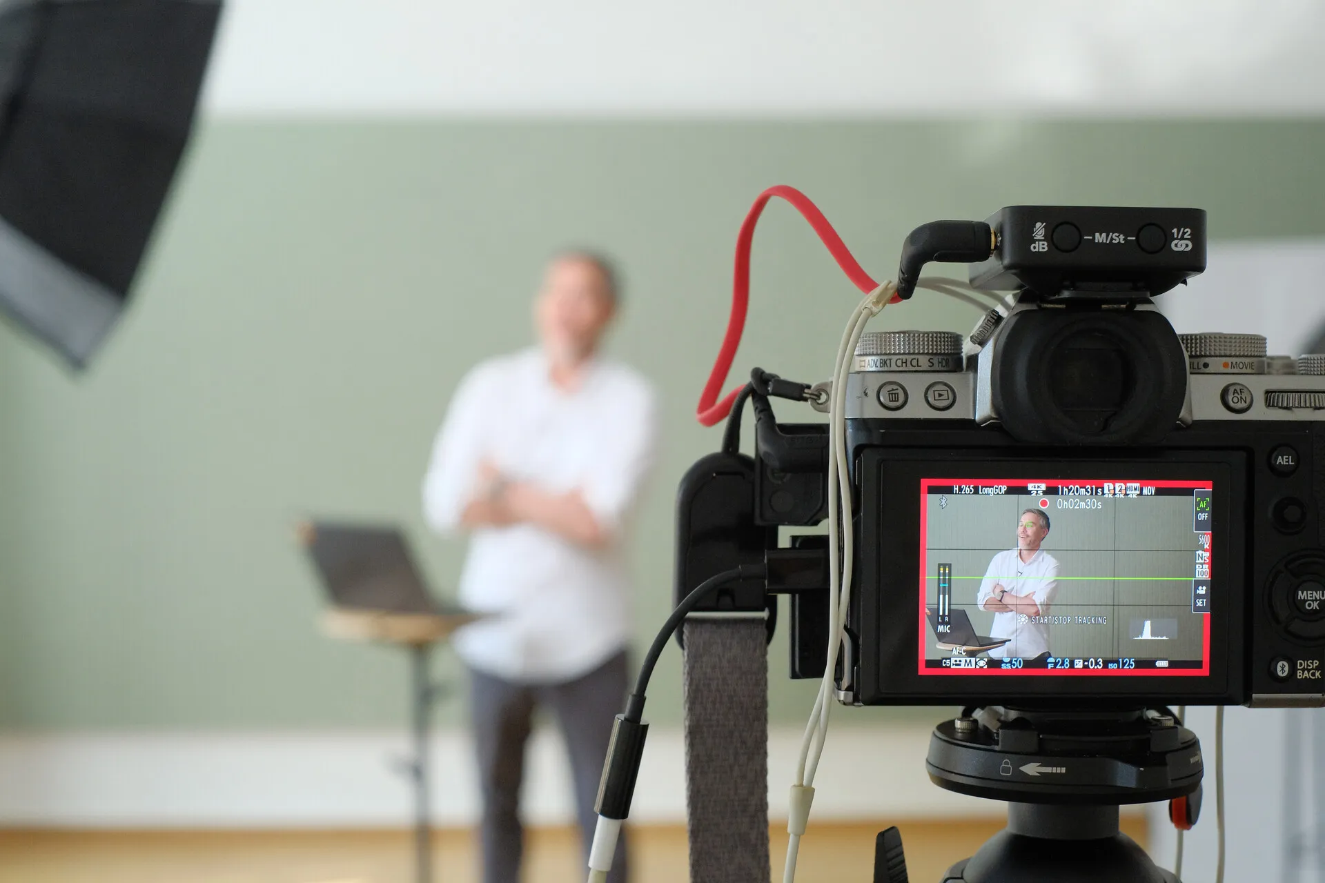 Behind the scenes during a business video shoot in an office